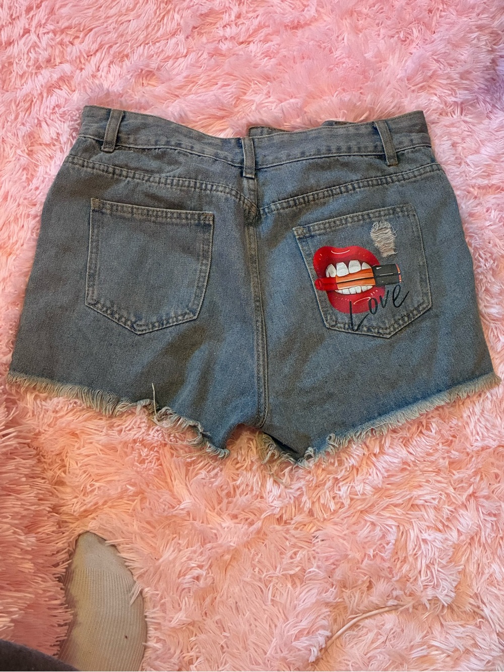 High-Rise Blue Denim Shorts with Red Lip Pocket Graphic